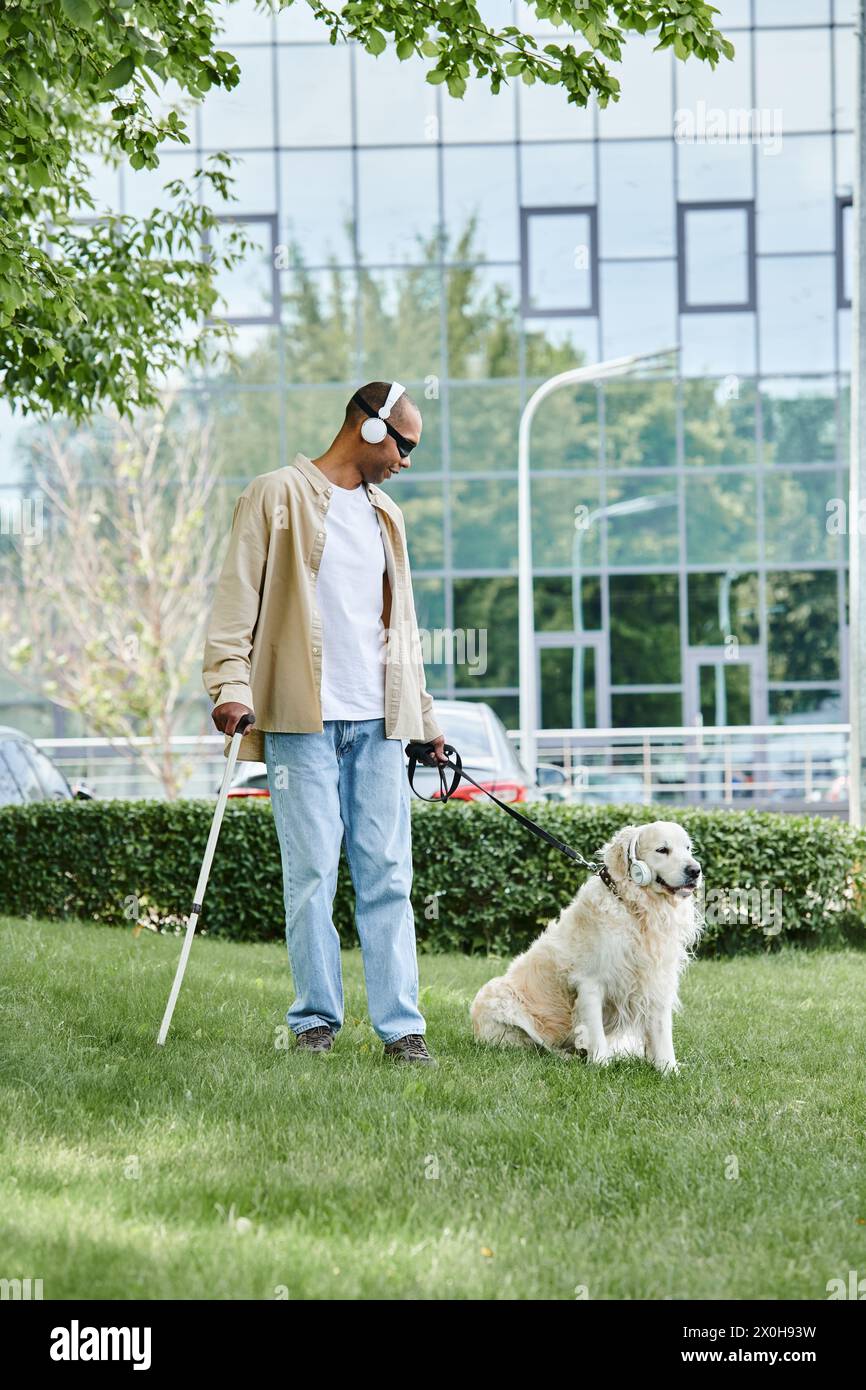 An African American man with myasthenia gravis syndrome walks a Labrador dog, promoting