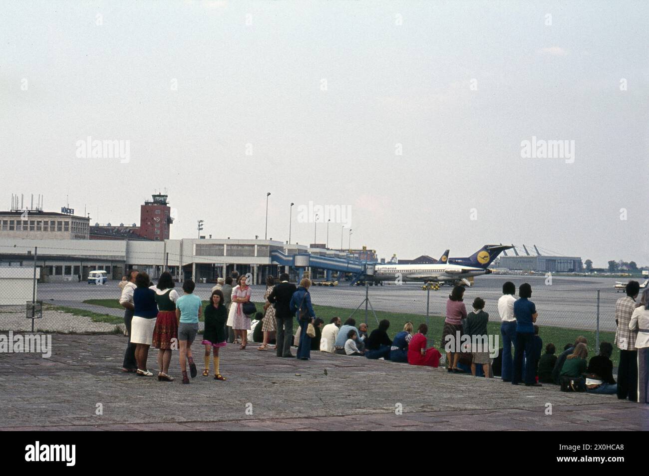 People looking at the runway at Munich Riem Airport. [automated ...