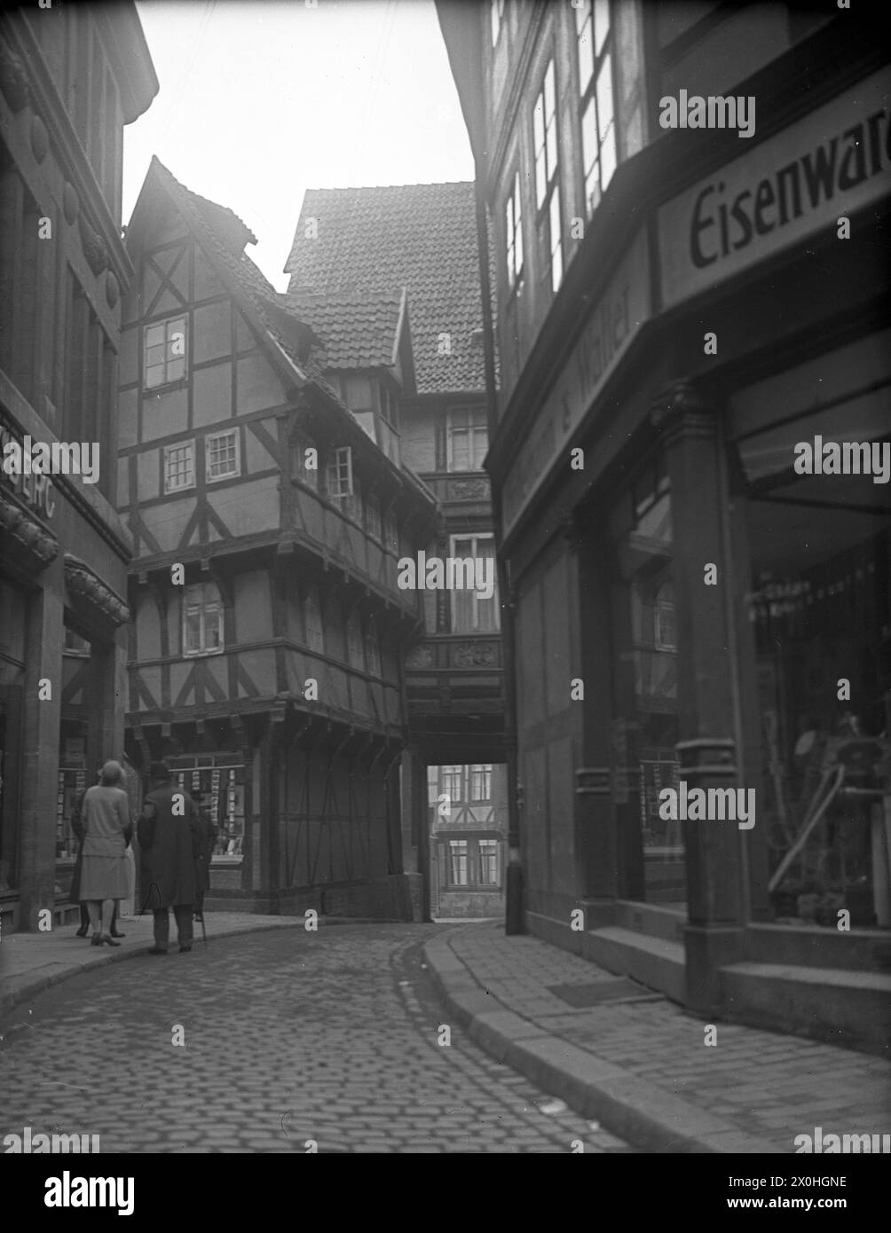 Sugar loaf turned upside down in an alley in Hildesheim around 1925