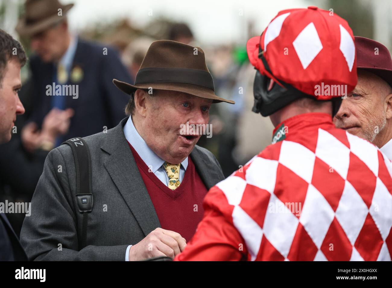 Nicky Henderson speaks to Nico De Boinville during the The Randox Grand