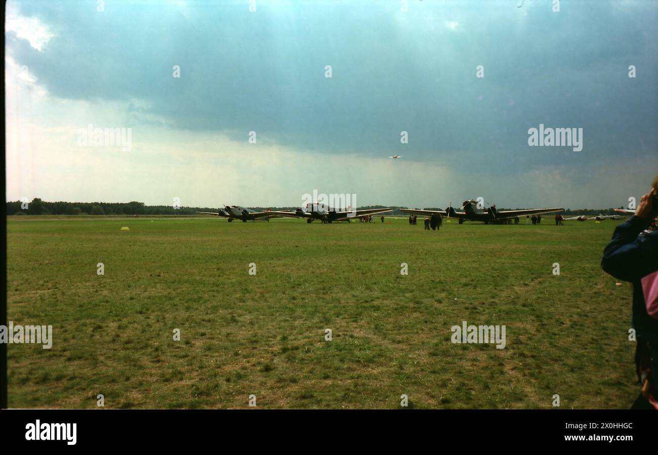 In the summer of 1994, the old Junkers factory airfield was (re)opened for civil aviation after having been used largely for military purposes. It was a moving experience to see 4 JU 52s (three Swiss and the one from Lufthansa) flying in formation and low over the airfield. [automated translation] Stock Photo