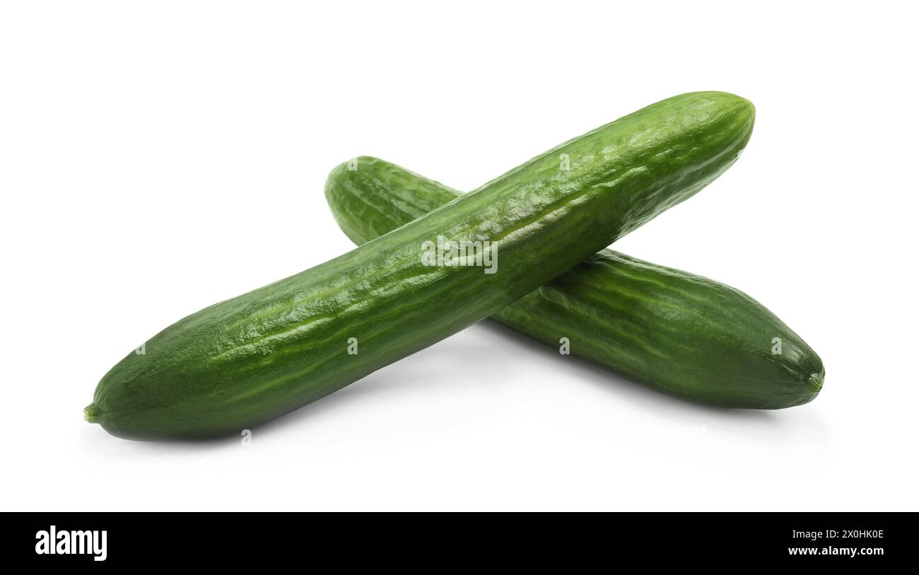 Two long fresh cucumbers isolated on white Stock Photo