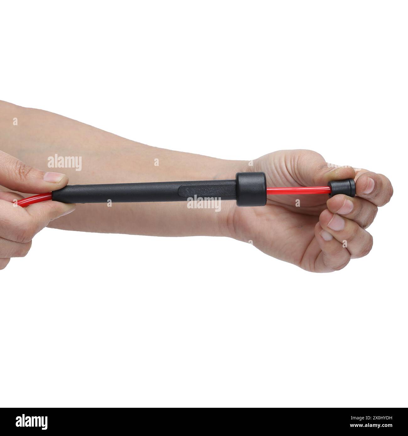 red black skipping rope hold in hand on white background Stock Photo