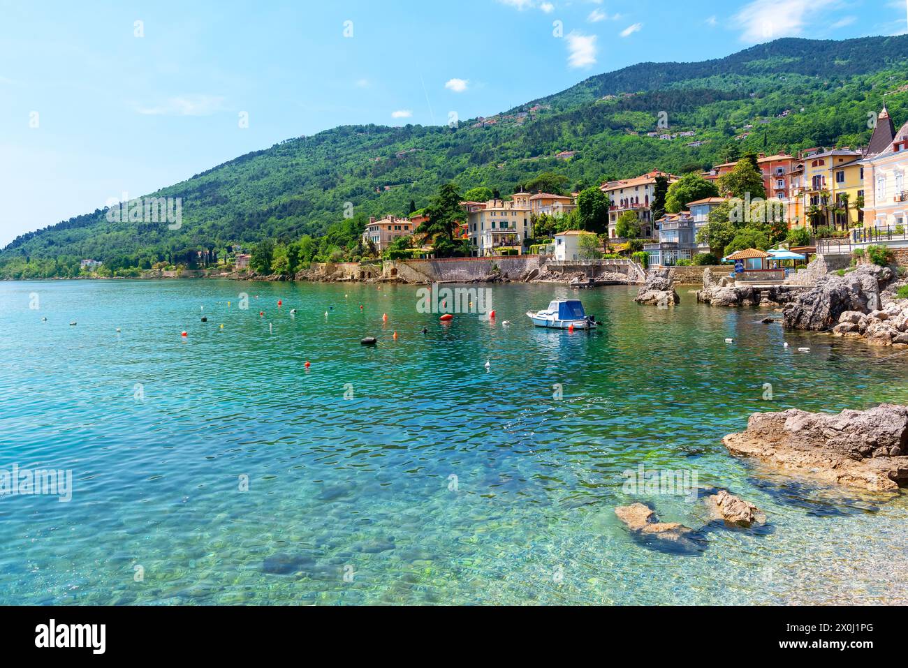 Beautiful coastline with boat and rocks in Lovran, Istria, Croatia Stock Photo