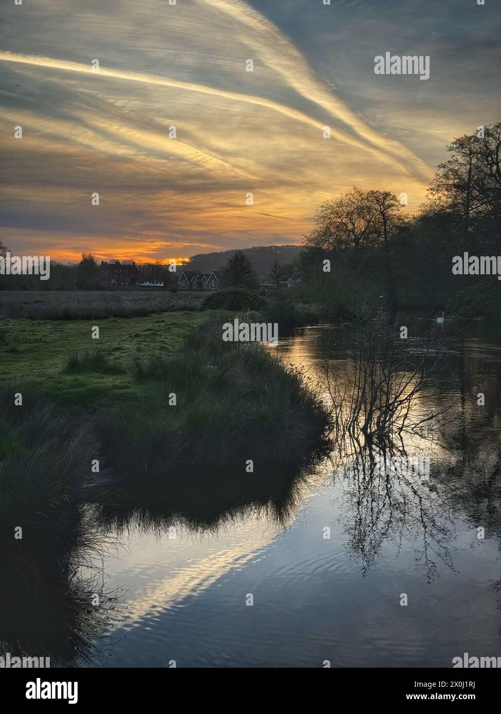 Lammas Lands, Godalming. 12th April 2024. A beautiful start to the day for the Home Counties. Sunrise over the River Wey floodplain in Godalming in Surrey Credit: james jagger/Alamy Live News Stock Photo