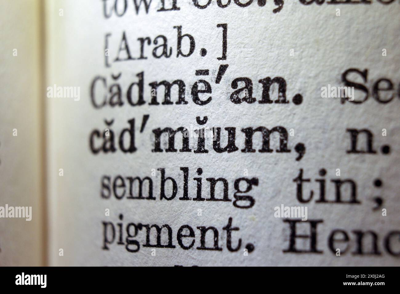 Word cadmium on dictionary page, macro close-up Stock Photo