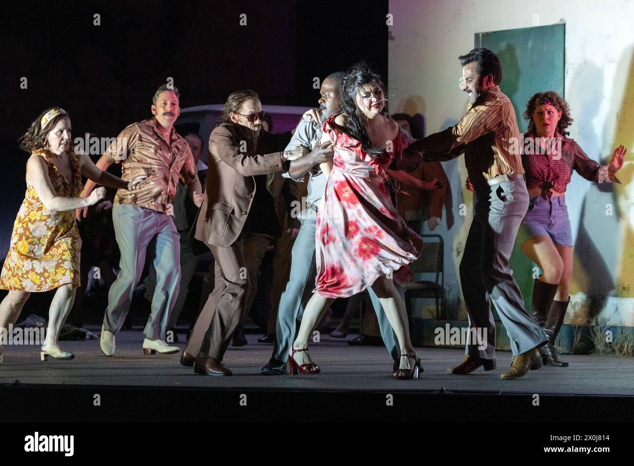 front centre, l-r: Vincent Ordonneau (Remendado), Blaise Malaba (Zuniga),  Aigul Akhmetshina (Carmen), Pierre Doyen (Dancairo) in CARMEN at the Royal Opera House, Covent Garden, London WC2  05/04/2024 music: Georges Bizet  libretto: Henri Meilhac & Ludovic Halevy  dramaturg: Elisa Zaninotto  conductor: Antonello Manacorda  set design: Paulo Fantin  costumes: Carla Teti  lighting: Alessandro Carletti  director: Damiano Michieletto Stock Photo