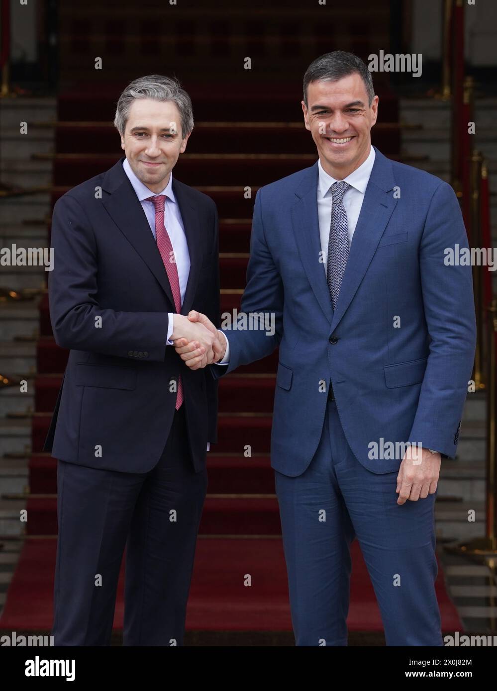 Taoiseach Simon Harris (left) welcomes Spanish Prime Minister Pedro Sanchez to the Government Buildings, Dublin. Picture date: Friday April 12, 2024. Stock Photo