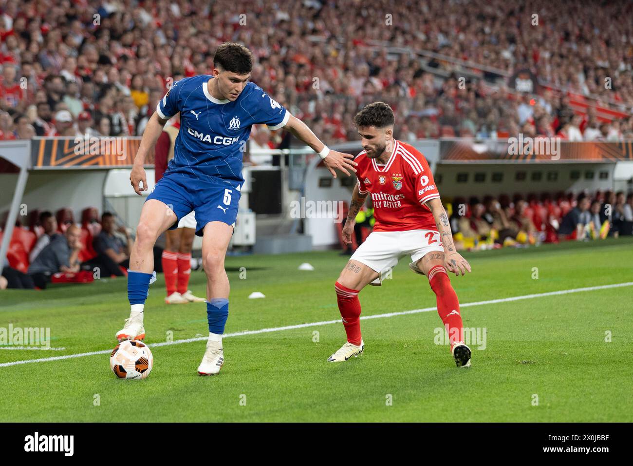 April 11, 2024. Lisbon, Portugal. Marseille's defender from Switzerland Ulisses Garcia (6) and Benfica's forward from Portugal Rafa Silva (27) in action during the game of the 1st Leg of Quarter Finals for the UEFA Europa League Playoffs, SL Benfica vs Olympique de Marseille Credit: Alexandre de Sousa/Alamy Live News Stock Photo
