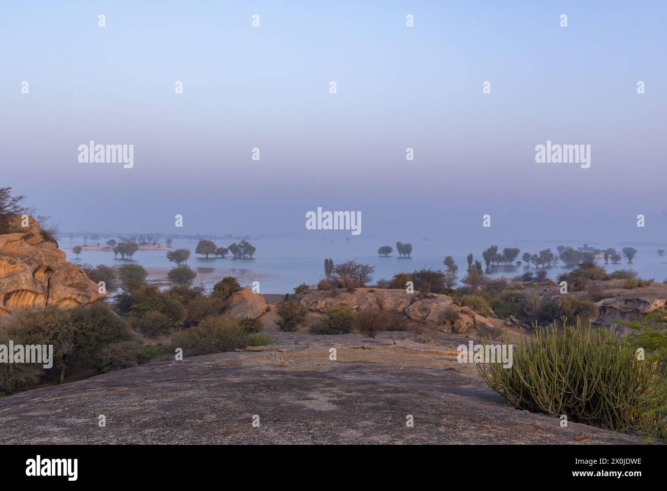 View of Jawai Dam as seen from a rocky hillock during early morning hours (Rajasthan, India) Stock Photo