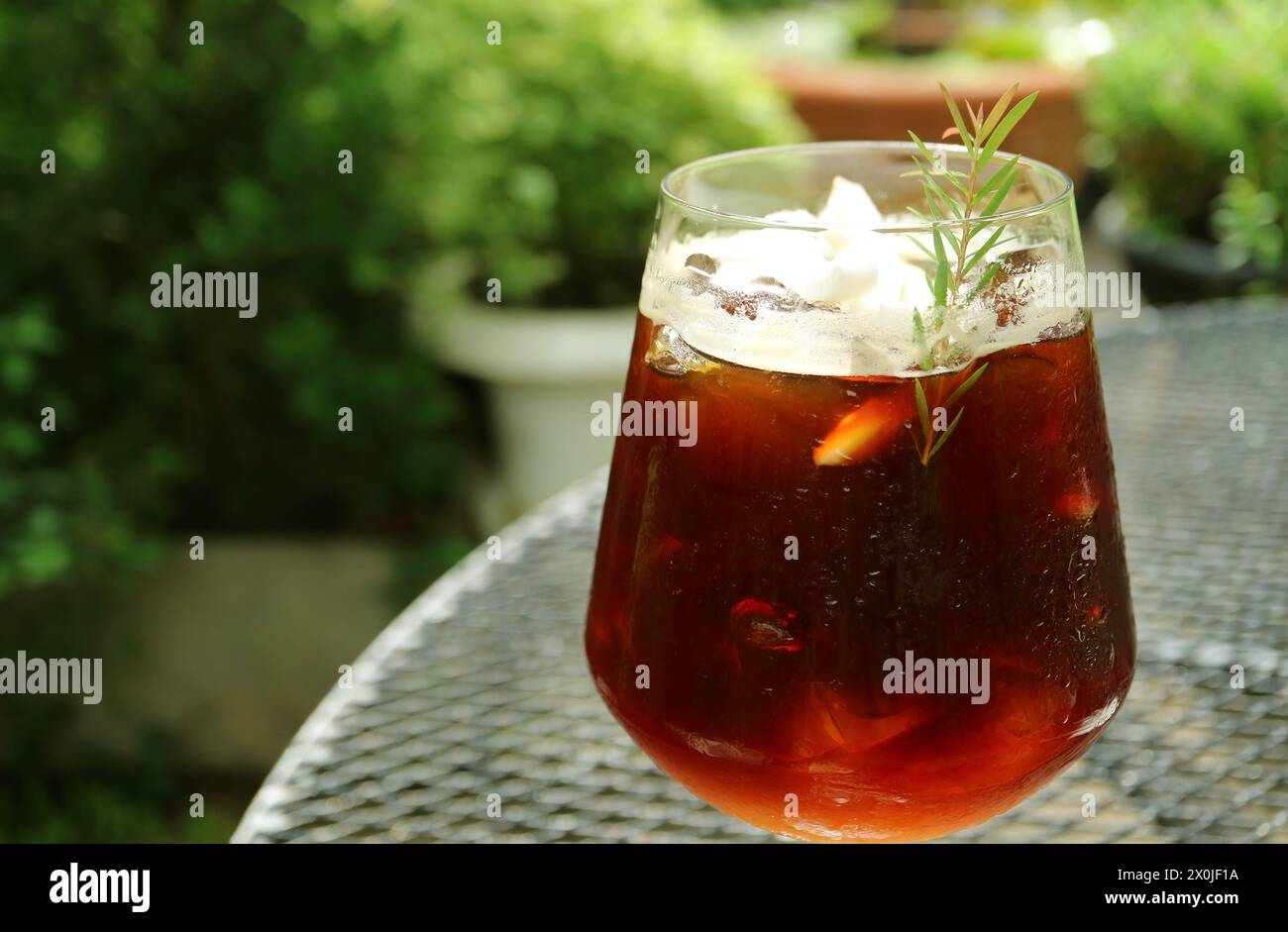 Closeup of a Glass of Iced Coffee at the Outdoor Seating Stock Photo