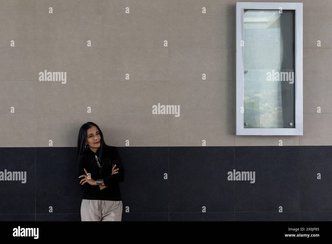 Adult woman (55) and Latin American mother posing for the camera. Concept business woman and spending time Stock Photo