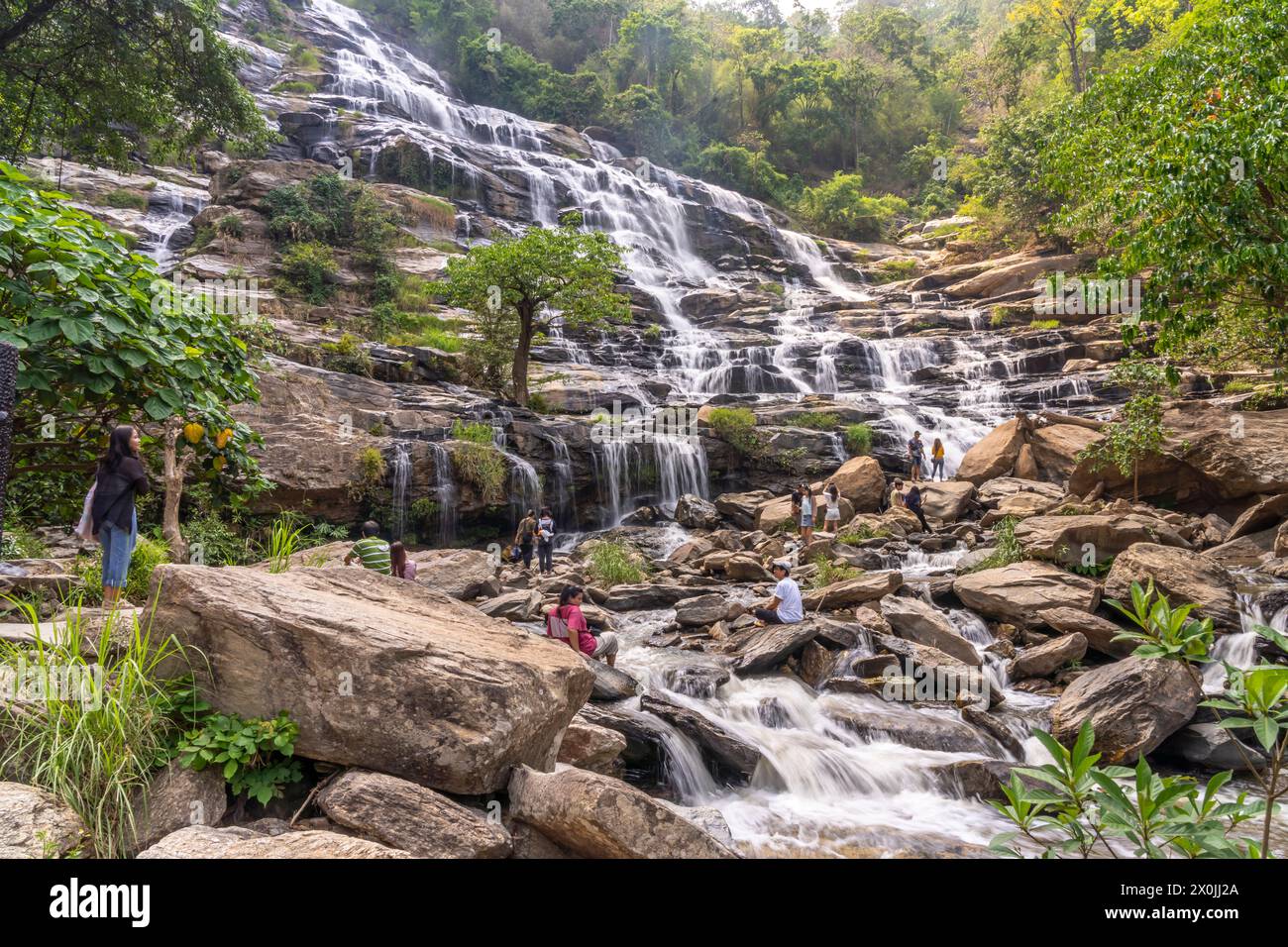 Visitors at Mae Ya waterfall in Doi Inthanon National Park near Chom Thong, Chiang Mai, Thailand, Asia Stock Photo