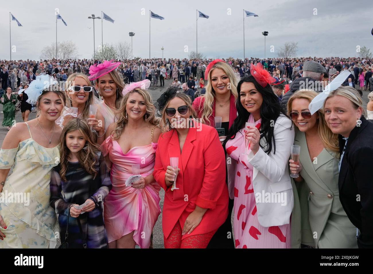 12th April 2024; Aintree Racecourse, Aintree, Merseyside, England: 2024 Grand National Festival Day 2; Racegoers pose for a photo during Ladies Day, day 2 of the festival Stock Photo