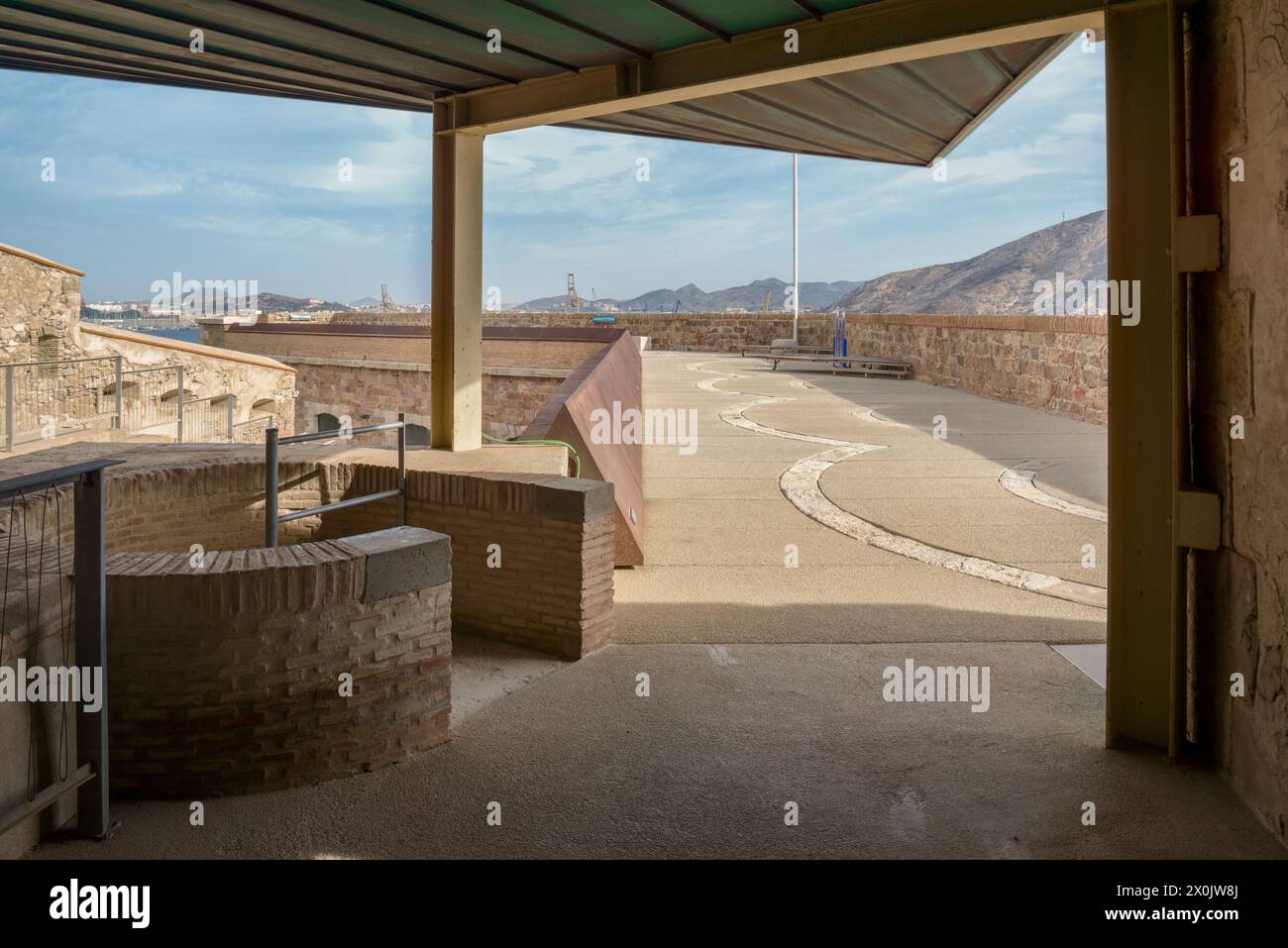 Spiral staircase on the upper terrace of the old Christmas Fort, to the right of the port of the neoclassical city of Cartagena, Region of Murcia. Stock Photo