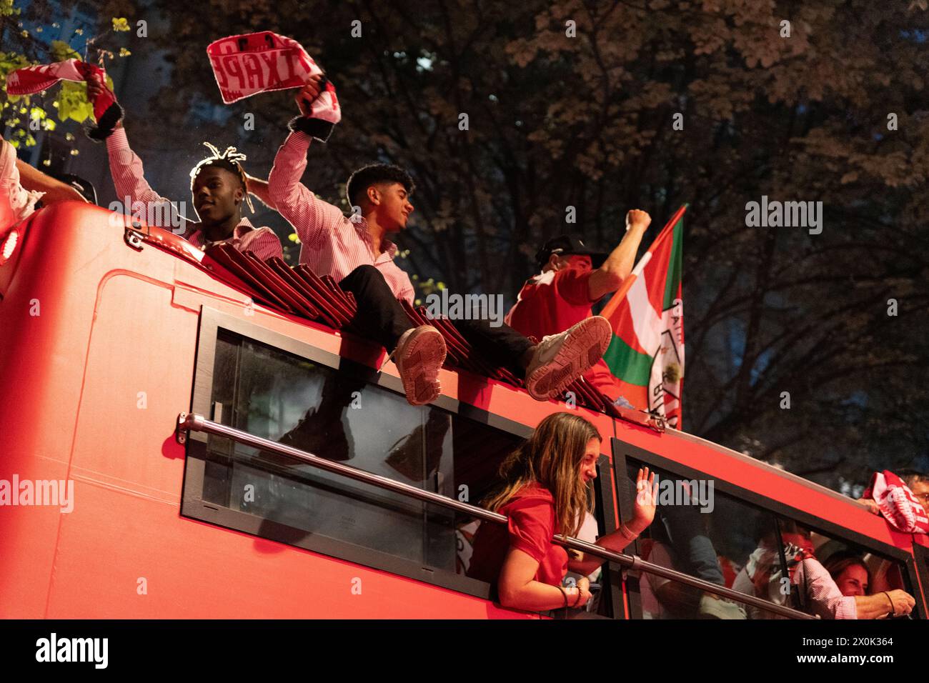 Bilbao, Biscay, Spain - April 11th 2024 - Athletic Club de Bilbao fans celebrate the 25th Copa del Rey title with the barge Stock Photo