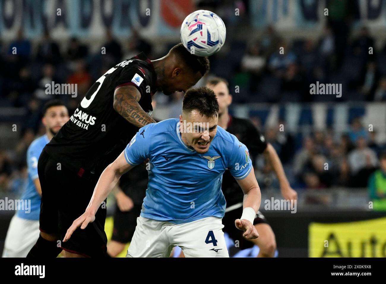Rome, Italy. 12th Apr, 2024. Jerome Boateng of US Salernitana and Patricio Gabarron Gil Patric of SS Lazio compete for the ball during the Serie A football match between SS Lazio and US Salernitana at Olimpico stadium in Rome (Italy), April 12, 2024. Credit: Insidefoto di andrea staccioli/Alamy Live News Stock Photo