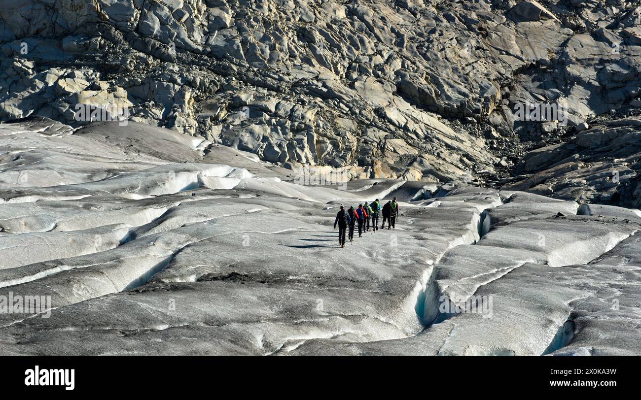 Hikers on a glacier trek on the Great Aletsch Glacier, UNESCO World Heritage Swiss Alps Jungfrau-Aletsch, Valais, Switzerland Stock Photo