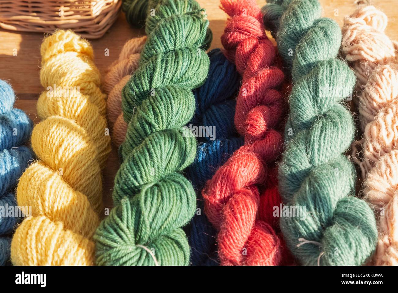 England, East Sussex, Battle, The Annual October Battle of Hastings Re-enactment Festival, Display of Colourful Wool for Sale Stock Photo