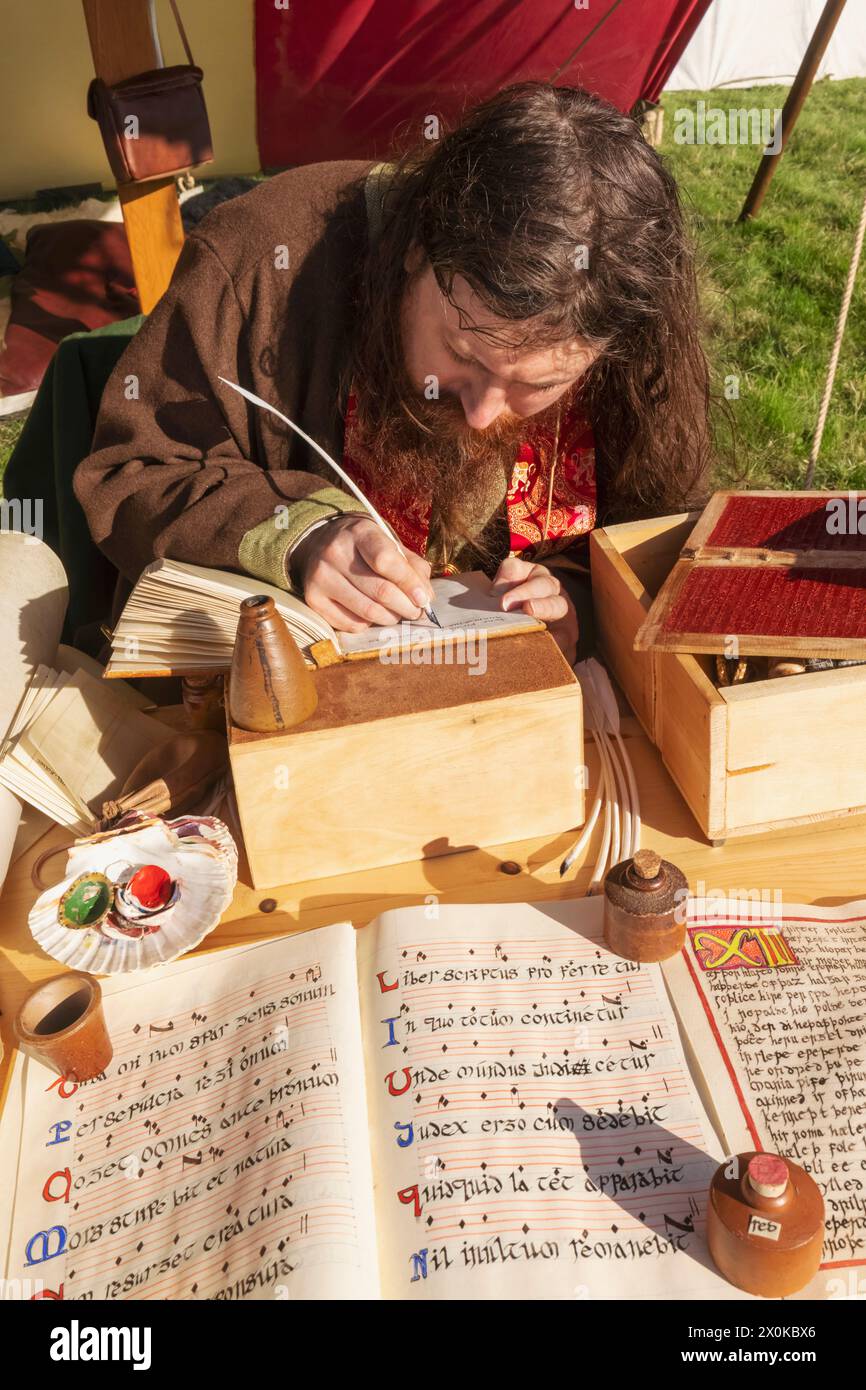 England, East Sussex, Battle, The Annual October Battle of Hastings Re-enactment Festival, Man Transcribing Medieval Texts Stock Photo
