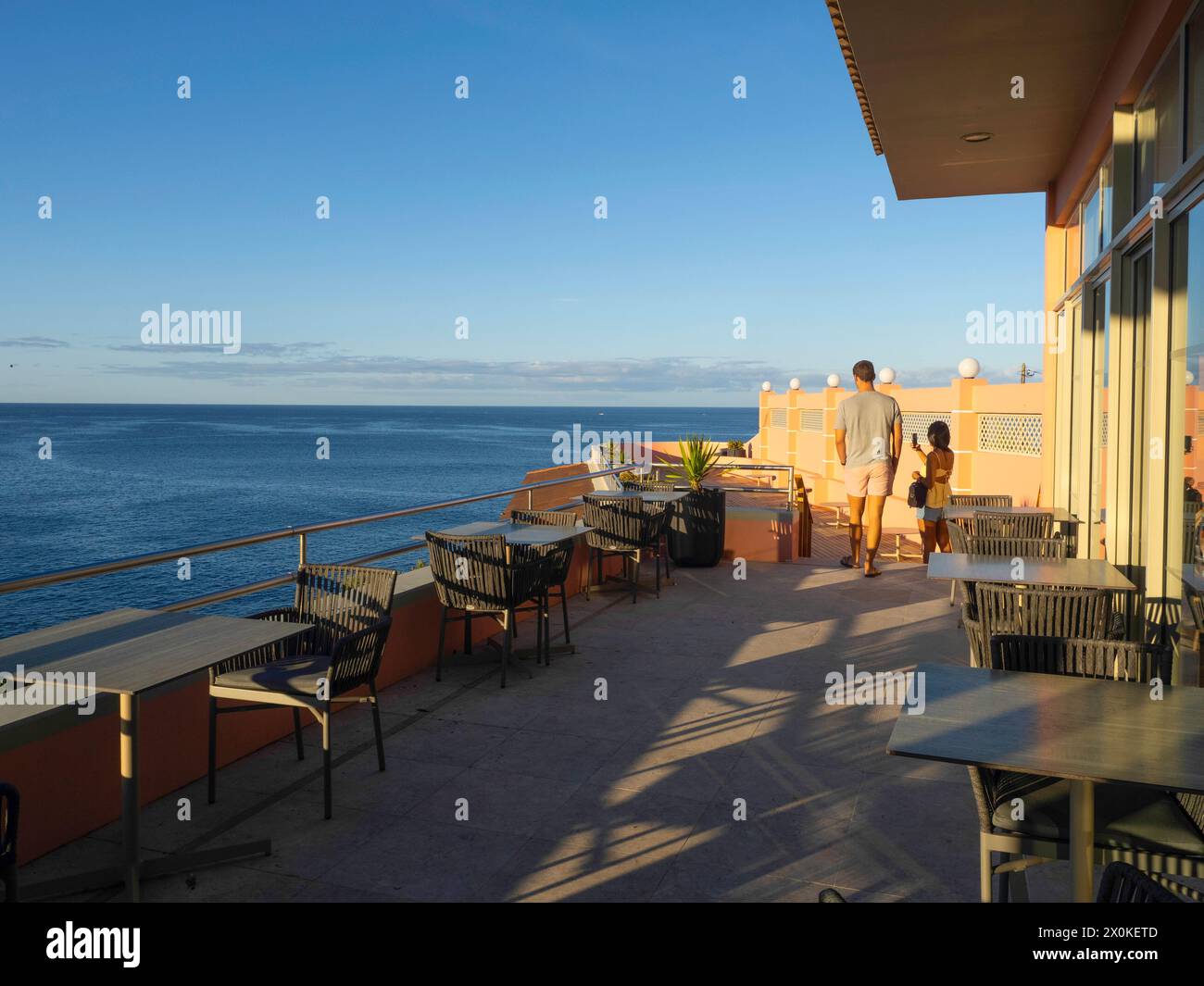 City of Angra do Heroismo, Azores, Portugal, Terceira, Terceira Mar Hotel terrace, couple admiring the ocean view Stock Photo