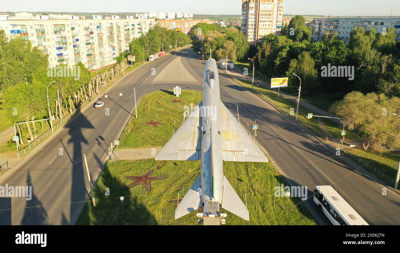Russia, Penza - May 27, 2021: aircraft monument. Penza, Russia. Monument to the plane in Penza. Monument fighter in flight against the blue sky. Stock Photo
