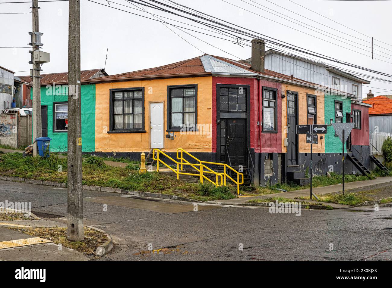 Colorful house at a crossroads. Punta Arenas, Patagonia y la Antarctica Chilena, Chile. Stock Photo
