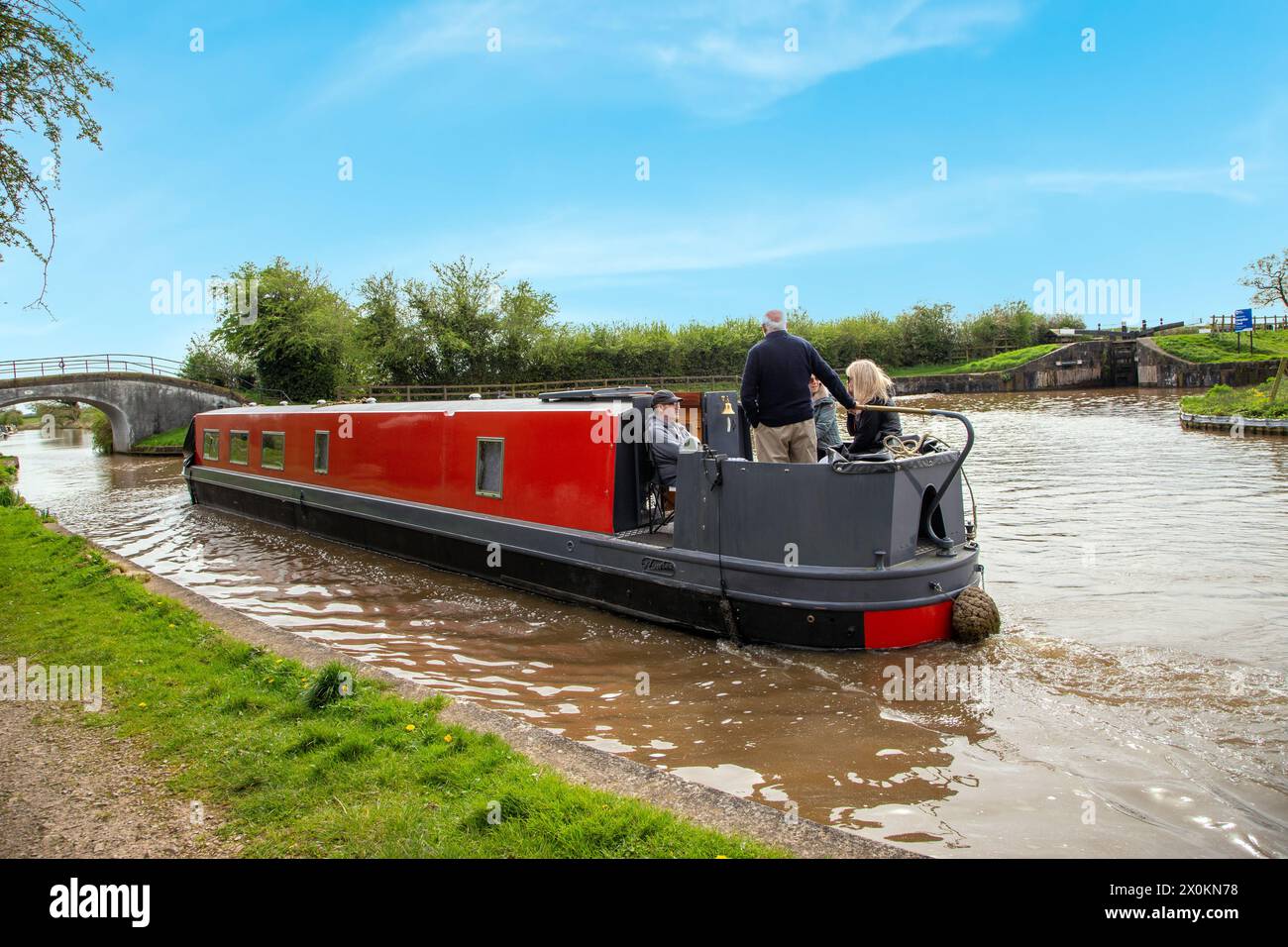 Canal narrowboat on the Shropshire union canal passing the junction with the llangollen canal at Hurleston junction Near Nantwich Cheshire Stock Photo
