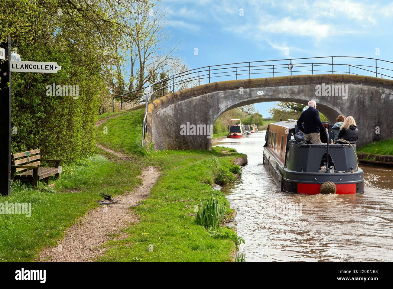 Canal narrowboat on the Shropshire union canal passing the junction with the llangollen canal at Hurleston junction Near Nantwich Cheshire Stock Photo