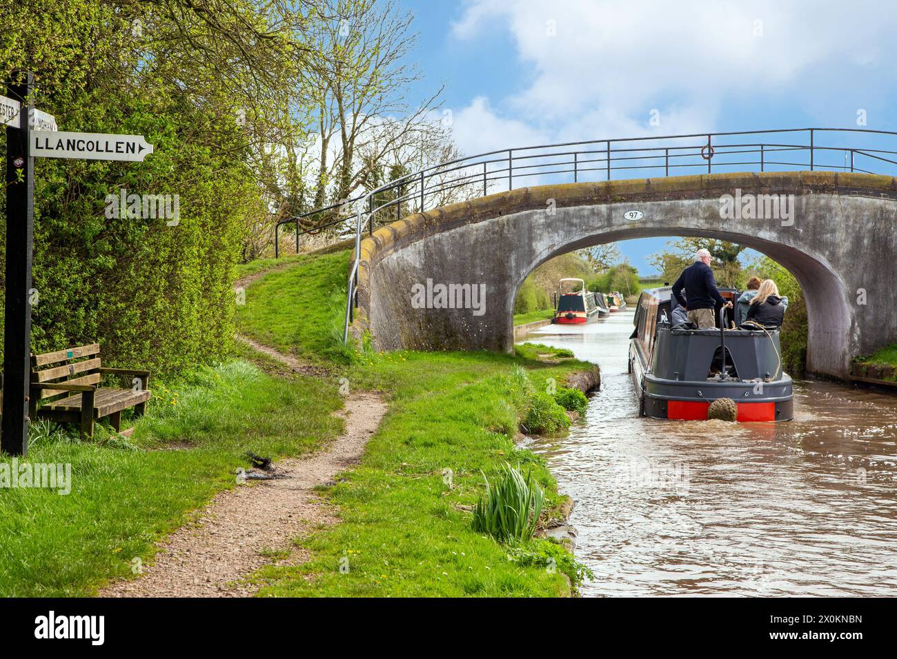 Canal narrowboat on the Shropshire union canal passing the junction with the llangollen canal at Hurleston junction Near Nantwich Cheshire Stock Photo