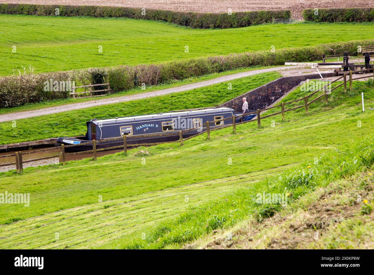 Canal narrowboat on the Llangollen canal as it passes through the Cheshire countryside before joining the Shropshire Union canal at Hurleston junction Stock Photo
