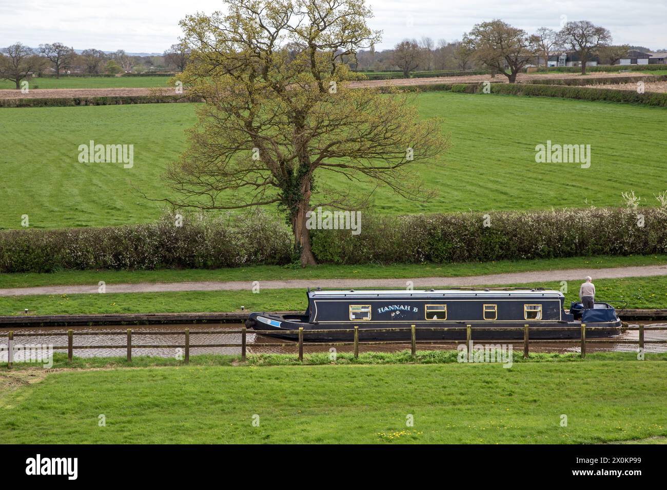 Canal narrowboat on the Llangollen canal as it passes through the Cheshire countryside before joining the Shropshire Union canal at Hurleston junction Stock Photo