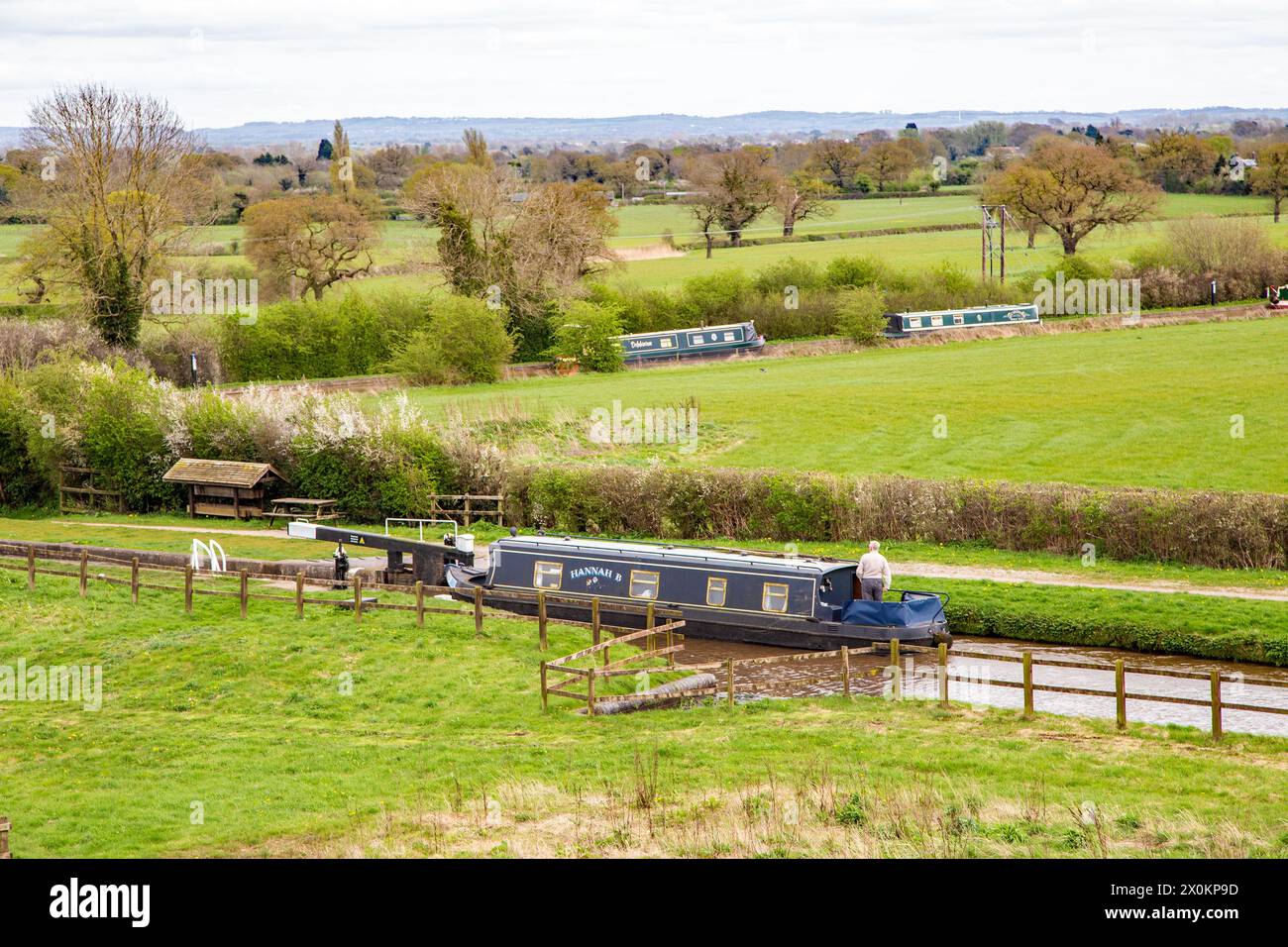 Canal narrowboat on the Llangollen canal as it passes through the Cheshire countryside before joining the Shropshire Union canal at Hurleston junction Stock Photo