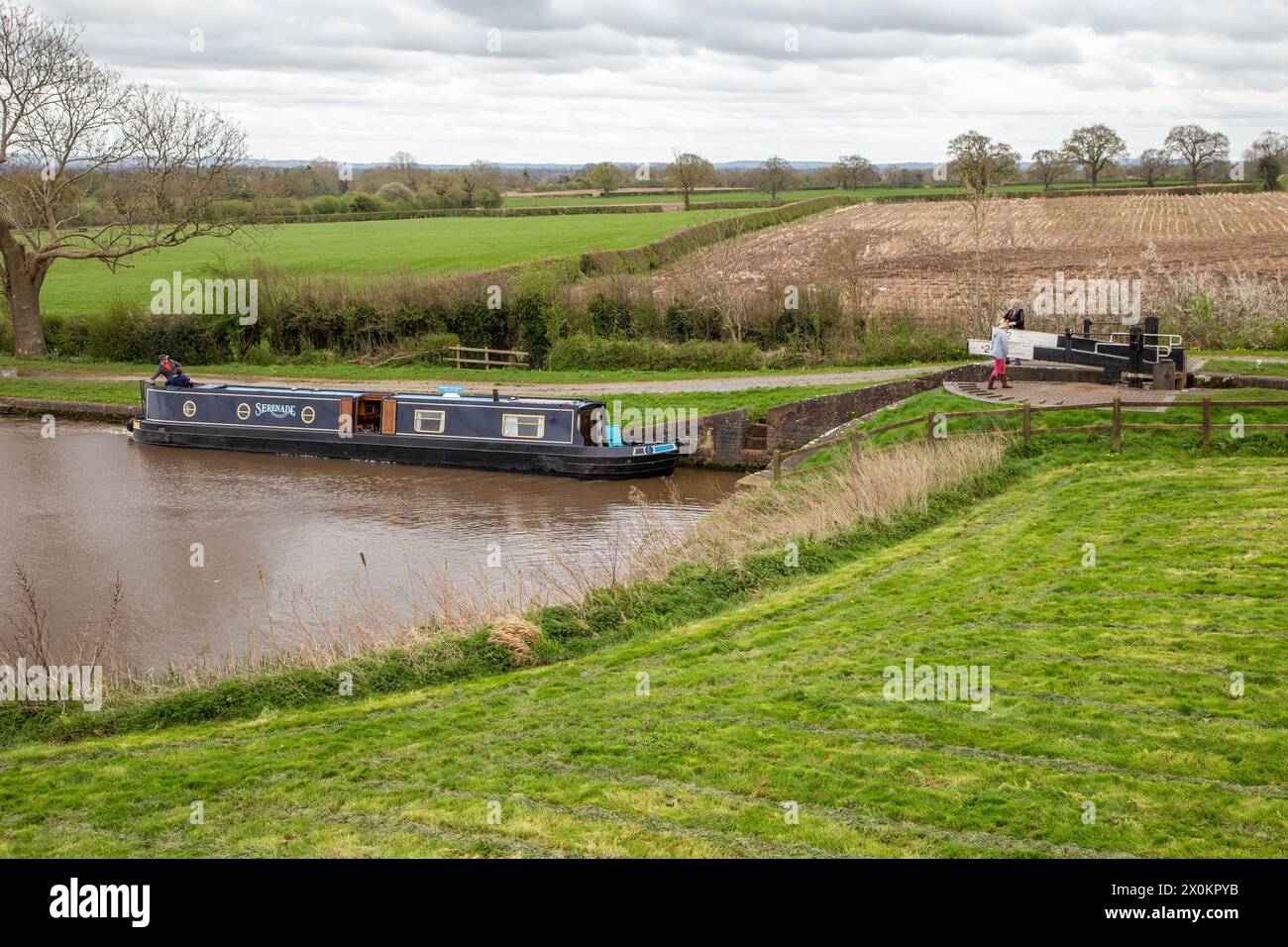 Canal narrowboat passing through the Hurleston flight of lock on the Llangollen canal after leaving the Shropshire Union canal at Hurleston junction Stock Photo