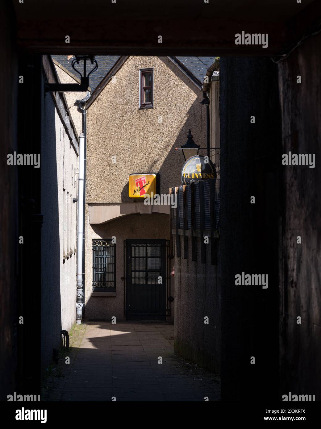 12 April 2024. High Street,Elgin,Moray,Scotland. This is Diceys Bar at the end of the tunnel leading from the High Street in Elgin on a bright sunny d Stock Photo