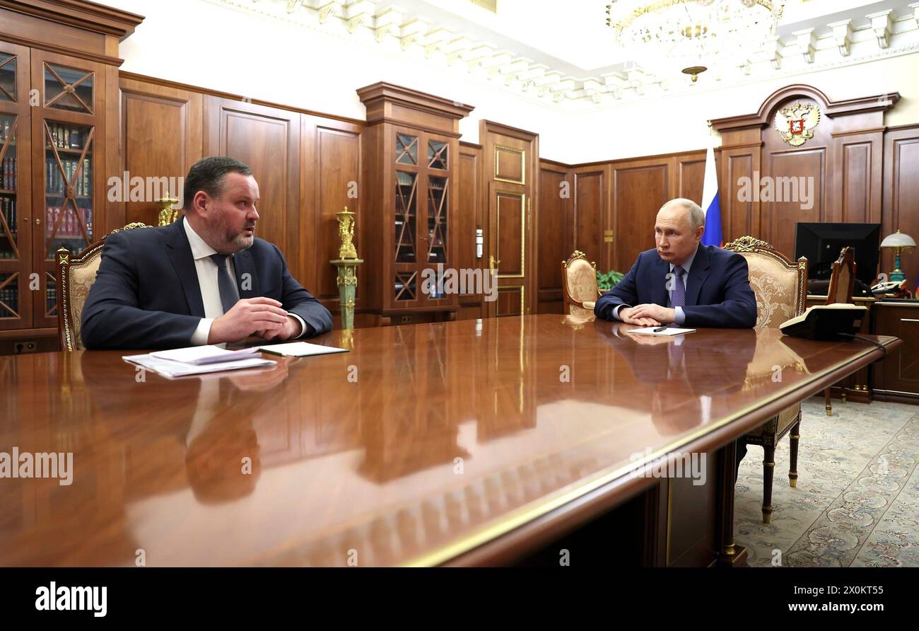 Moscow, Russia. 10th Apr, 2024. Russian President Vladimir Putin, right, listens to Minister of Labour and Social Protection Anton Kotyakov, left, during a face-to-face meeting at the Kremlin, April 10, 2024 in Moscow, Russia. Kotyakov explained efforts to develop a Social Treasury system for Russian citizens. Credit: Gavriil Grigorov/Kremlin Pool/Alamy Live News Stock Photo