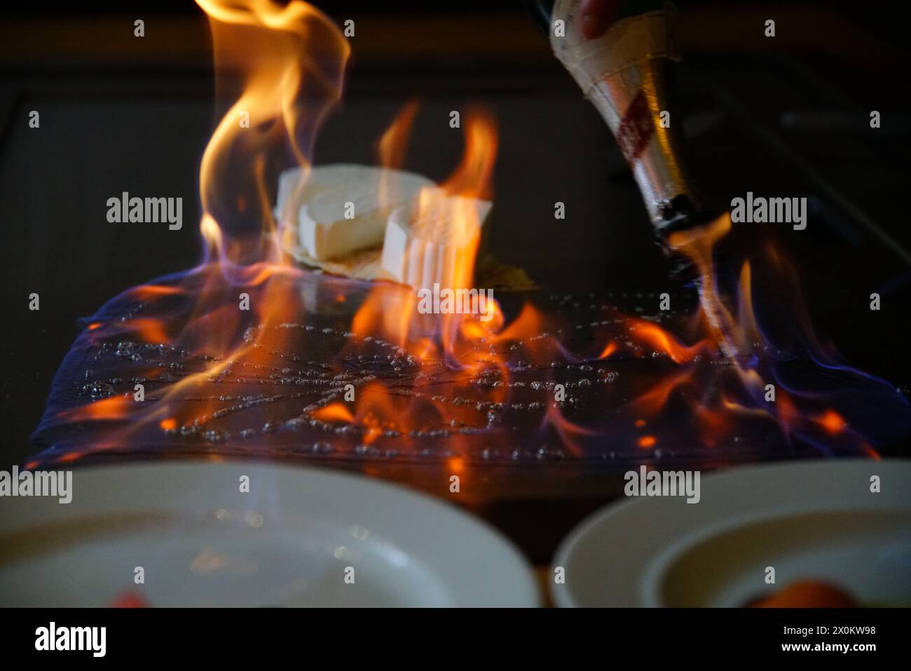 chef's hands with spatula over teppanyaki. cooking vegetables meat and