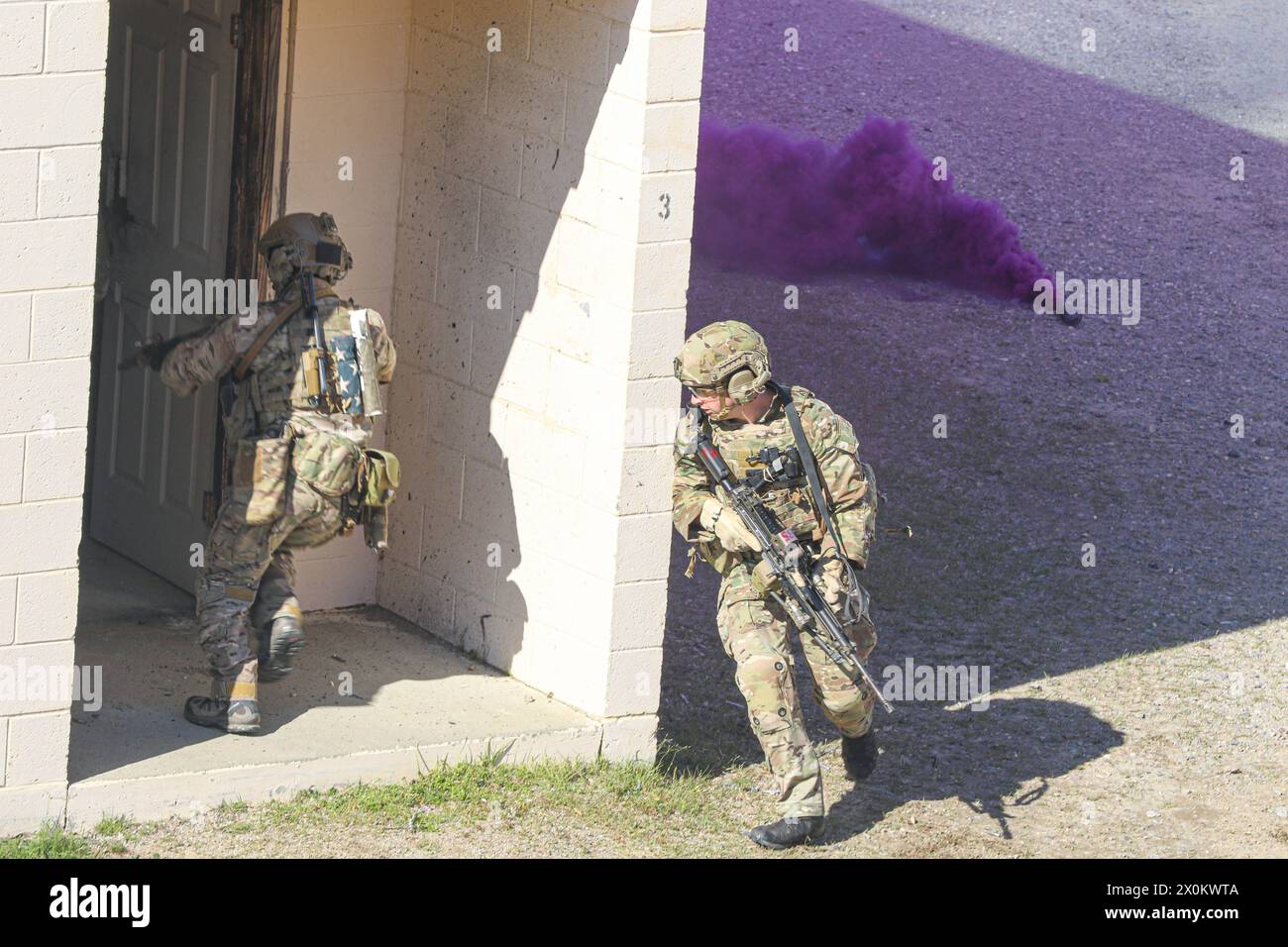 U.S. Army Rangers breach a door as part of the ranger assault operation ...