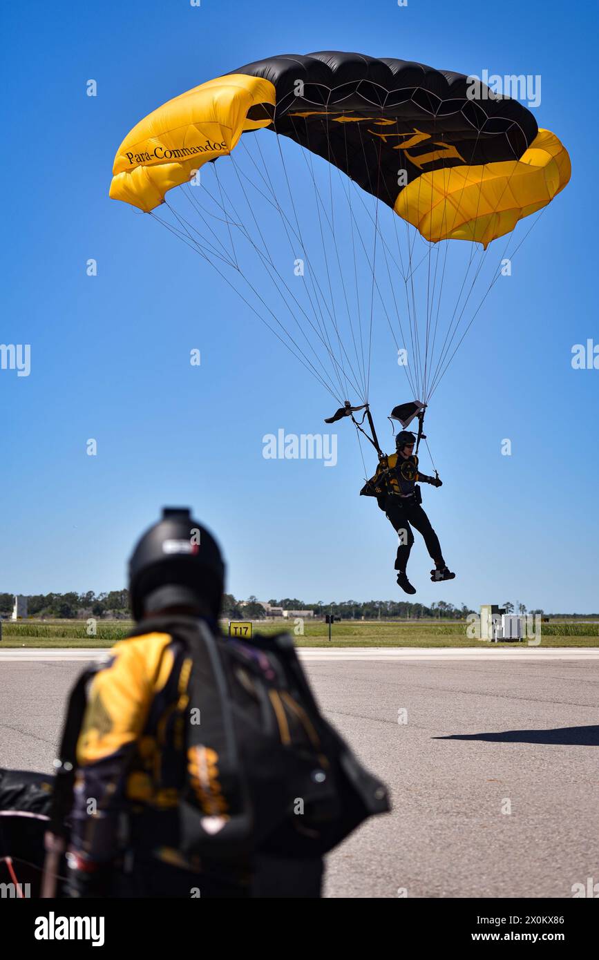 Czech Republic Lt. Col. Igor Kral, a member of the U.S. Special Operations Command Para-Commandos, prepares to land during the opening of the Tampa Bay AirFest at MacDill Air Force Base, Florida, March 29, 2024. The Para-Commandos are the U.S. SOCOM's premier parachute demonstration team who perform at events across the nation, informing the public about U.S. SOCOM, its mission, and the contributions more than 70,000 Soldiers, Sailors, Airmen, Marines, Guardians and Department of Defense Civilians are making across the U.S. and in more than 70 countries around the globe. Tampa Bay AirFest feat Stock Photo