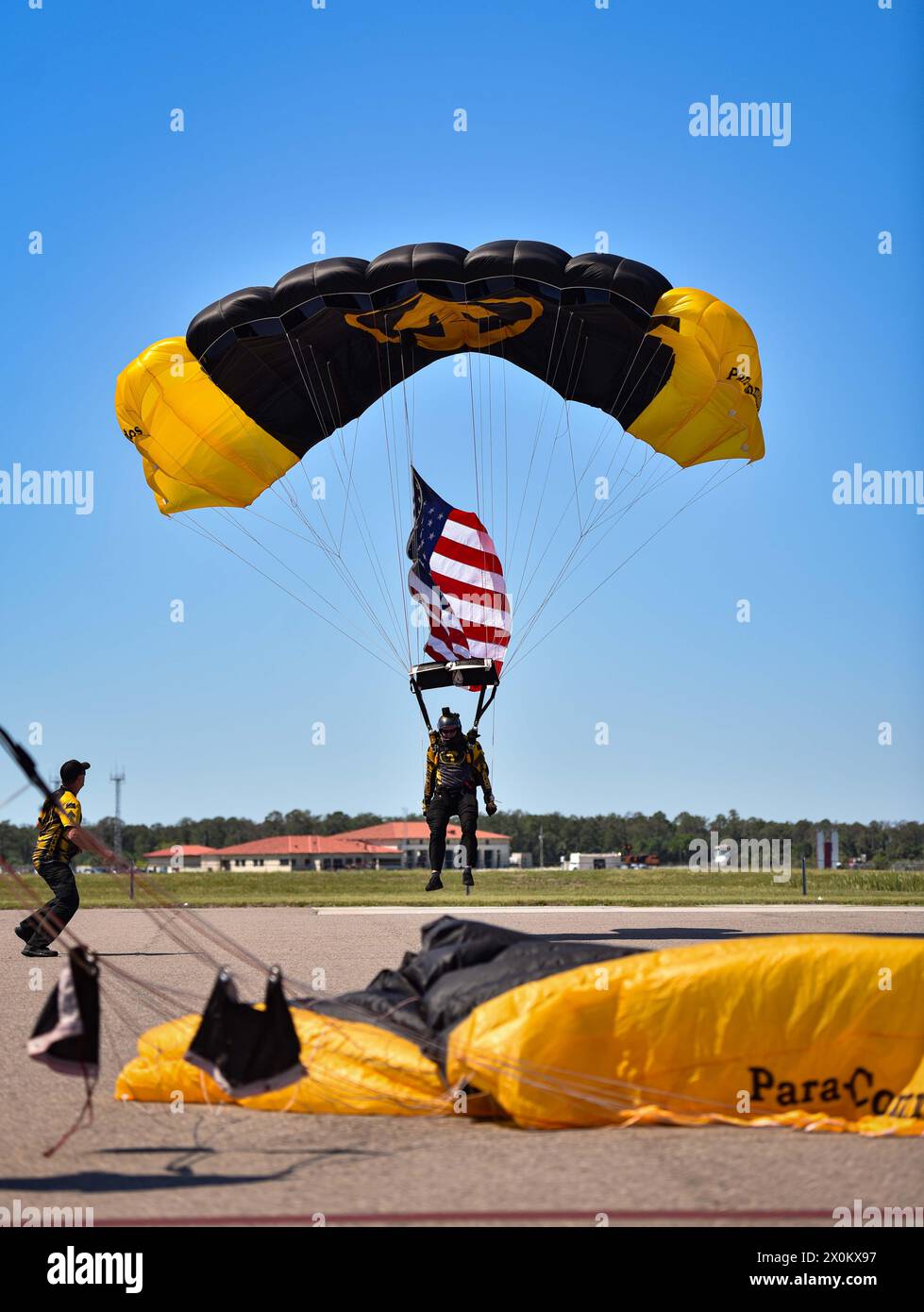 Retired U.S. Army Sgt. Maj. Tim Groves, a former Green Beret and current team leader of the U.S. Special Operations Command Para-Commandos, prepares to land during the opening of the Tampa Bay AirFest at MacDill Air Force Base, Florida, March 29, 2024. The Para-Commandos are the U.S. SOCOM's premier parachute demonstration team who perform at events across the nation, informing the public about U.S. SOCOM, its mission, and the contributions more than 70,000 Soldiers, Sailors, Airmen, Marines, Guardians and Department of Defense Civilians are making across the U.S. and in more than 70 countries Stock Photo