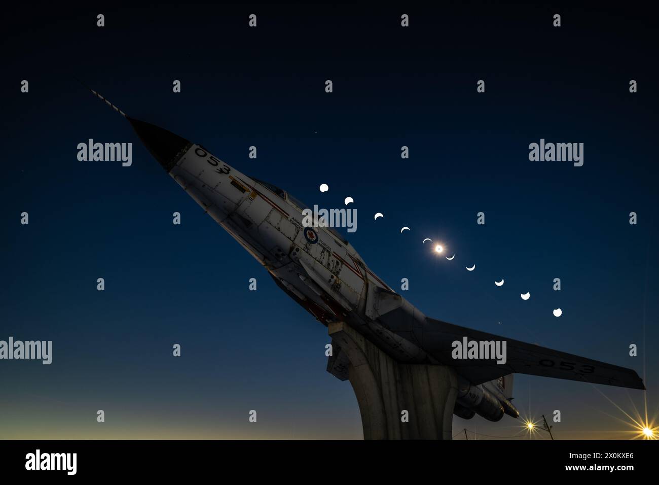 CF101 Voodoo jetfighter gate guardian under composite image of total solar eclipse viewed from