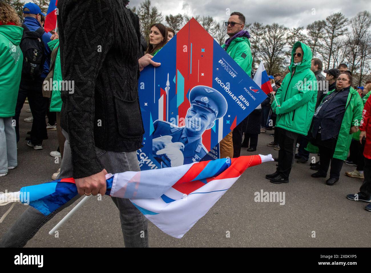 Moscow, Russia. 12th of April, 2024. A man holds a poster with a prortait of a Soviet pilot and cosmonaut Yuri Gagarin on Cosmonautics Day during the Russia Expo international forum and exhibition at the VDNKh Exhibition Centre in Moscow, Russia. Credit: Nikolay Vinokurov/Alamy Live News Stock Photo