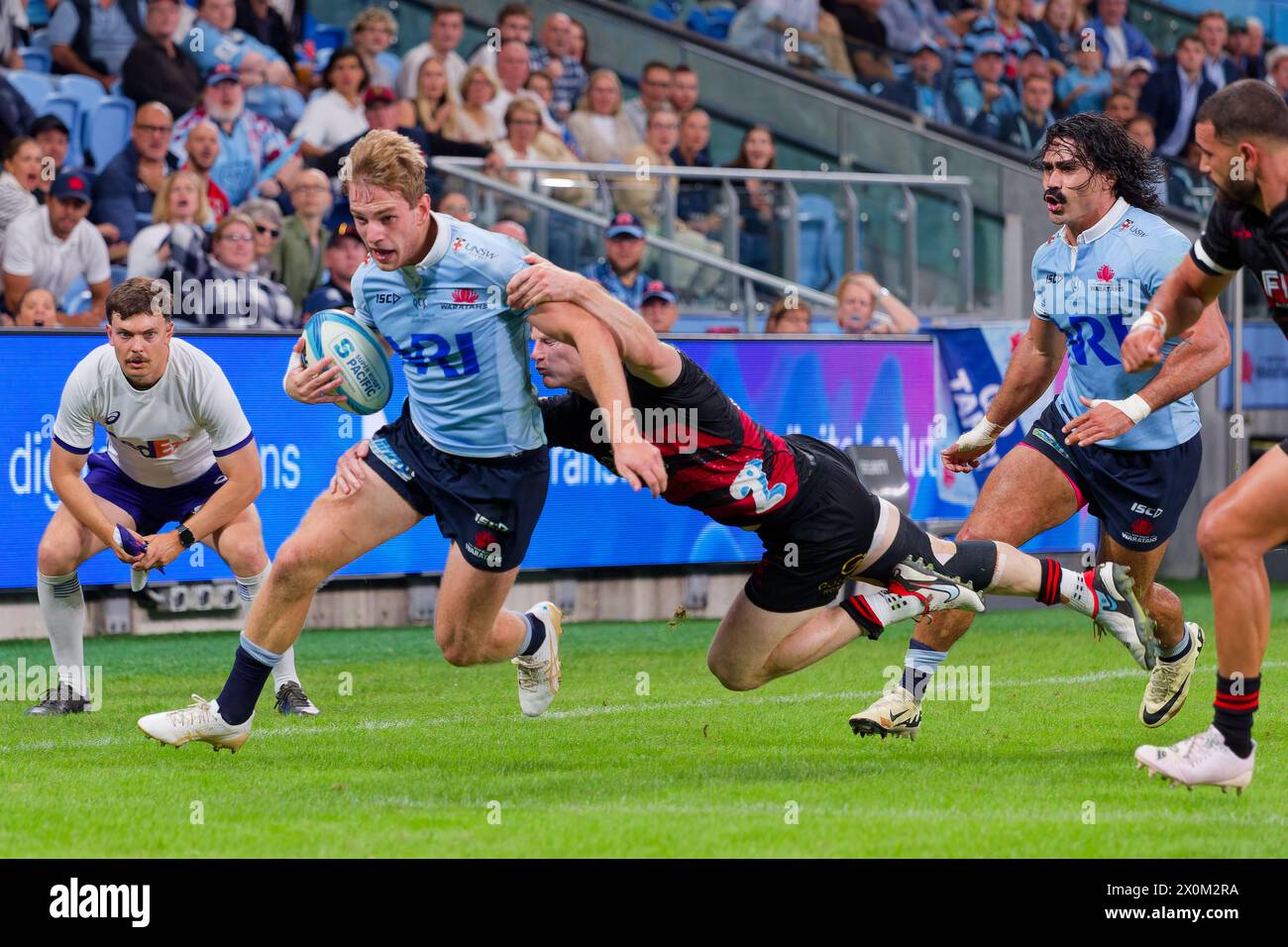 Sydney, Australia. 12th Apr, 2024. Max Jorgensen of the Waratahs is tackled by Johnny McNicholl of the Crusaders during the Super Rugby Pacific 2024 Rd8 match between the Waratahs and the Crusaders at Allianz Stadium on April 12, 2024 in Sydney, Australia. Credit: IOIO IMAGES/Alamy Live News Stock Photo