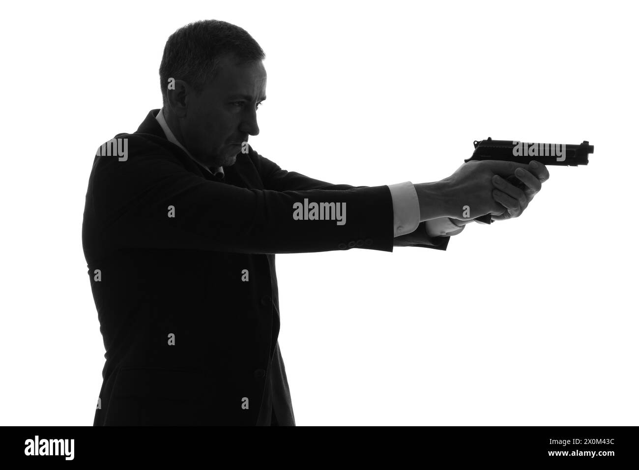 Silhouette of mature man with gun on white background Stock Photo