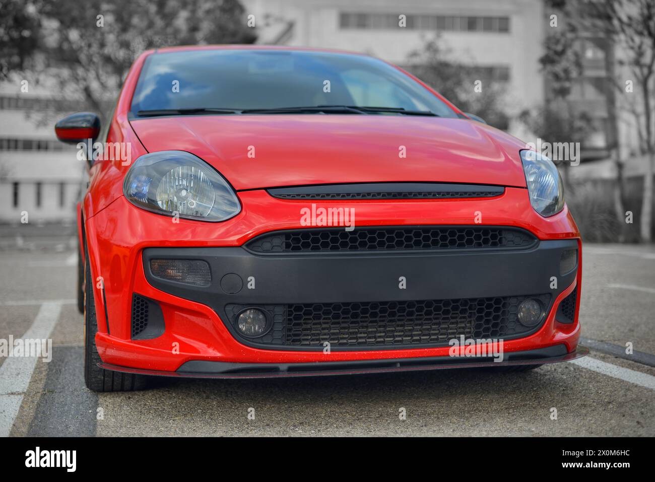 Red Italian hot hatch with a selective color of red Stock Photo