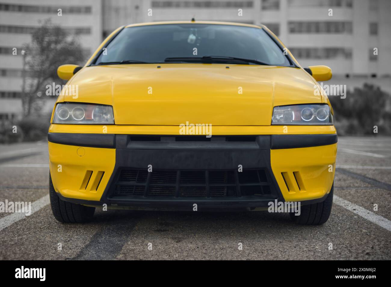 frontal photo of an Italian yellow hot hatch sport car Stock Photo