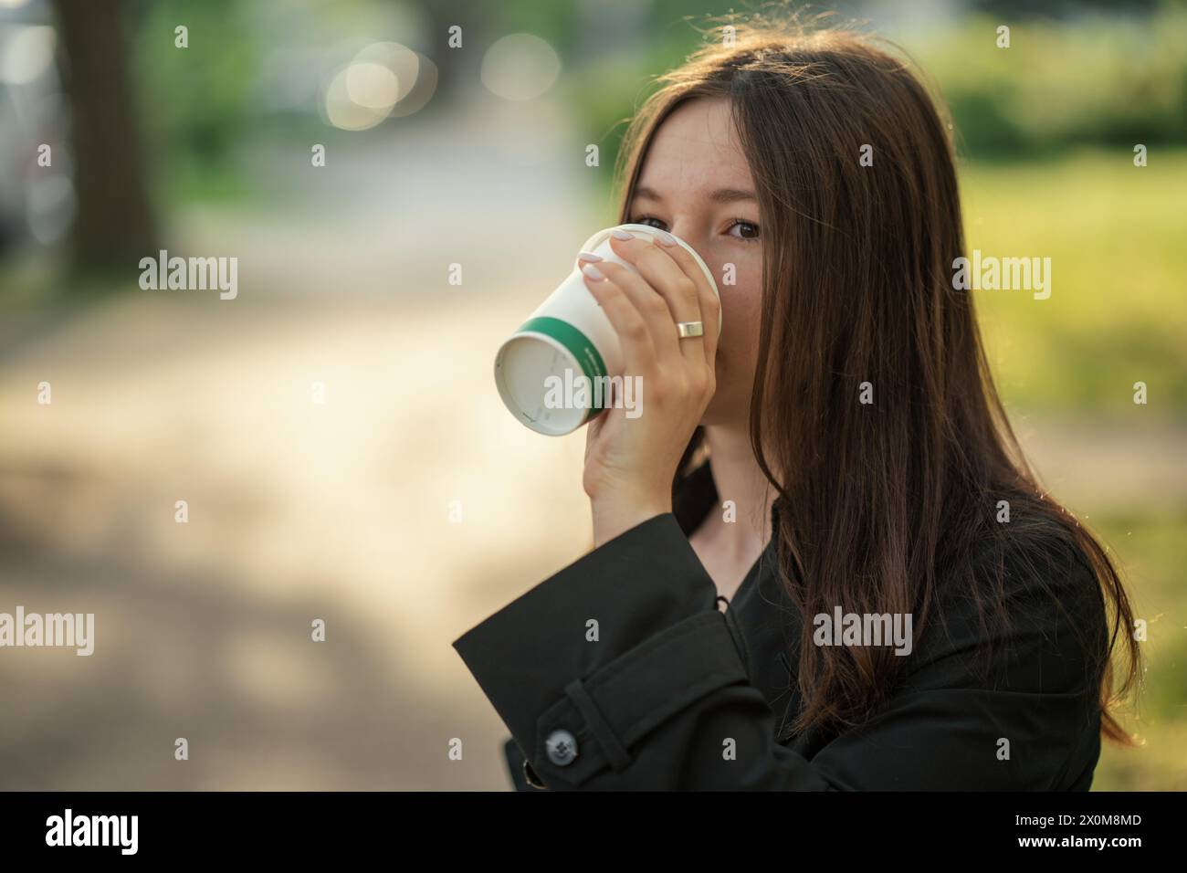 Teenage girl drinking coffee. Stock Photo