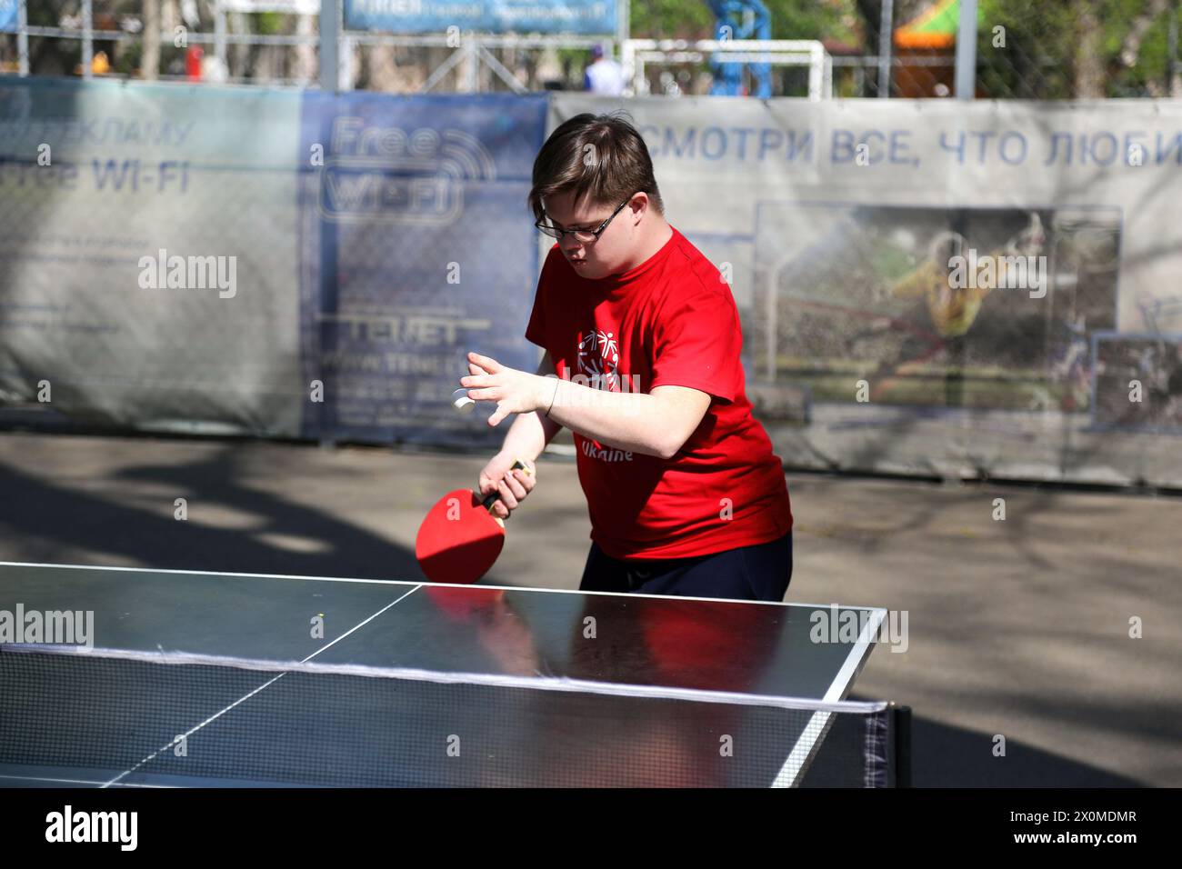 A Young Man With Special Needs Plays Table Tennis In Starobazarny a-young-man-with-special-needs-plays-table-tennis-in-starobazarny