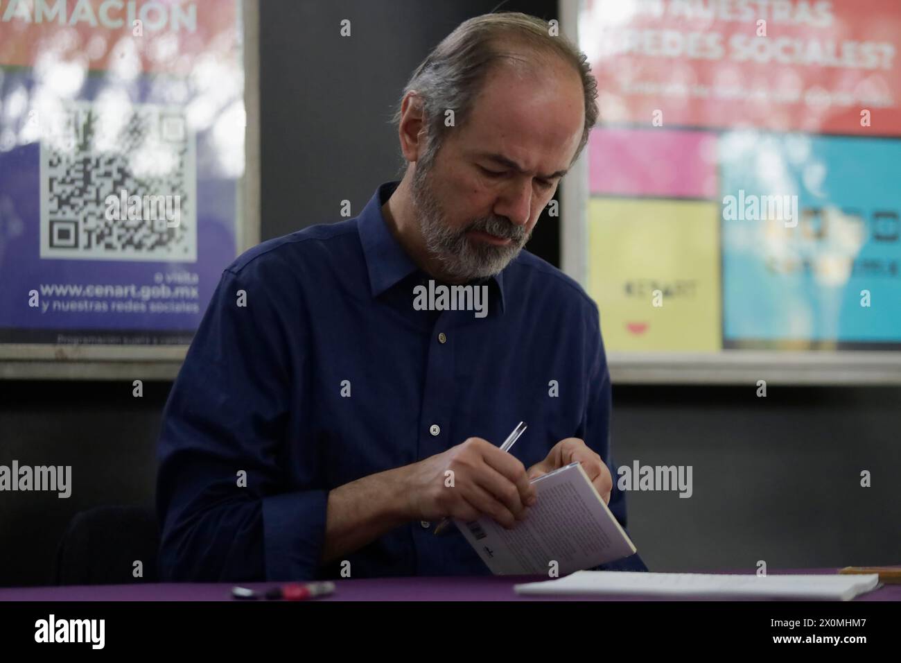 Mexico City, Mexico. 12th Apr, 2024. Juan Villoro is signing books at the National Center for the Arts in Mexico City, on the occasion of announcing his work ''Hotel Nirvana, '' which he wrote under the direction of Antonio Castro. (Photo by Gerardo Vieyra/NurPhoto)0 Credit: NurPhoto SRL/Alamy Live News Stock Photo