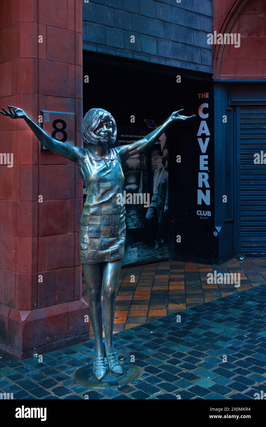 England, Liverpool - December 28, 2023: Cilia Black statue in front of the original Cavern Club in Mathew Street. Stock Photo